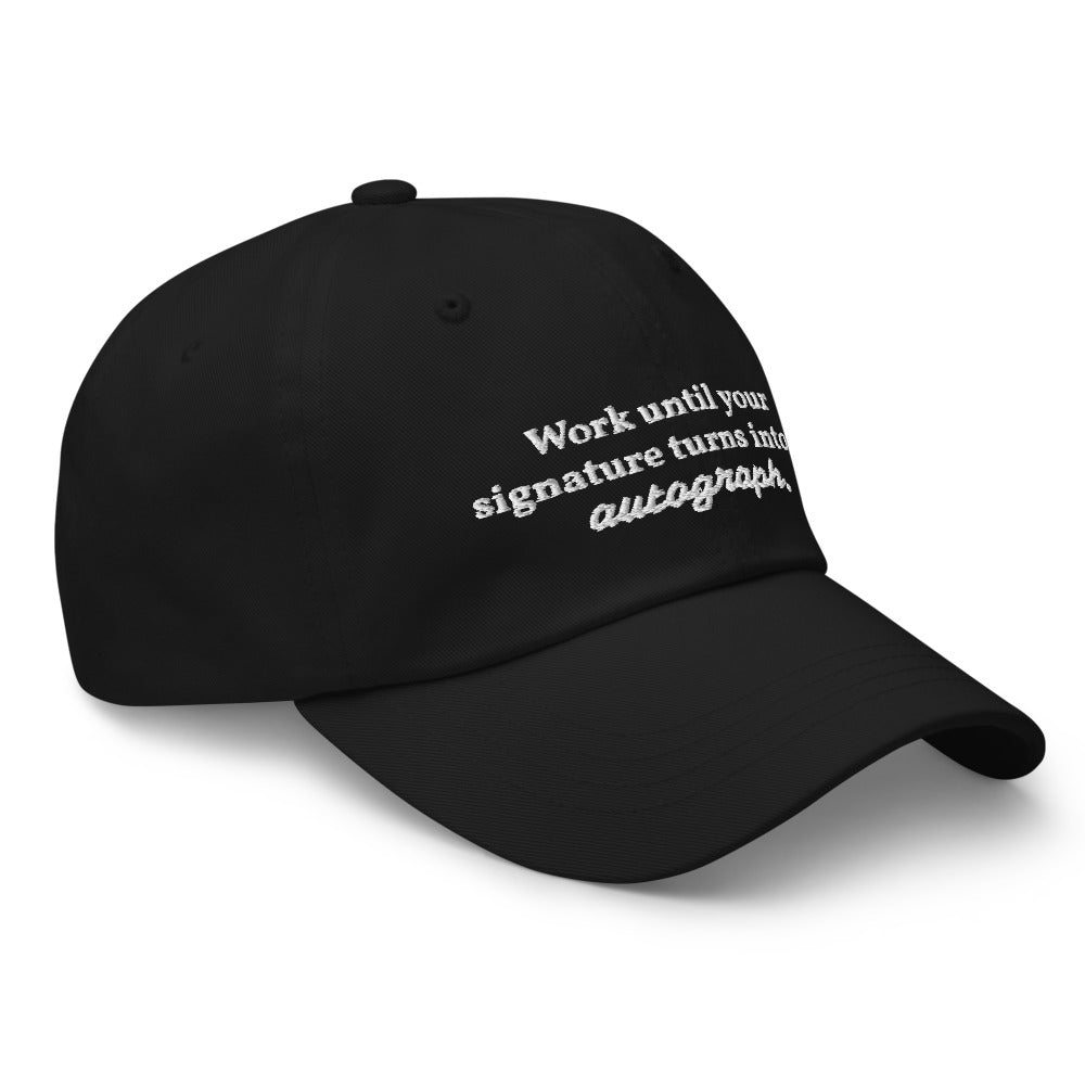 "Work until your signature turns into an autograph." Dad Hat