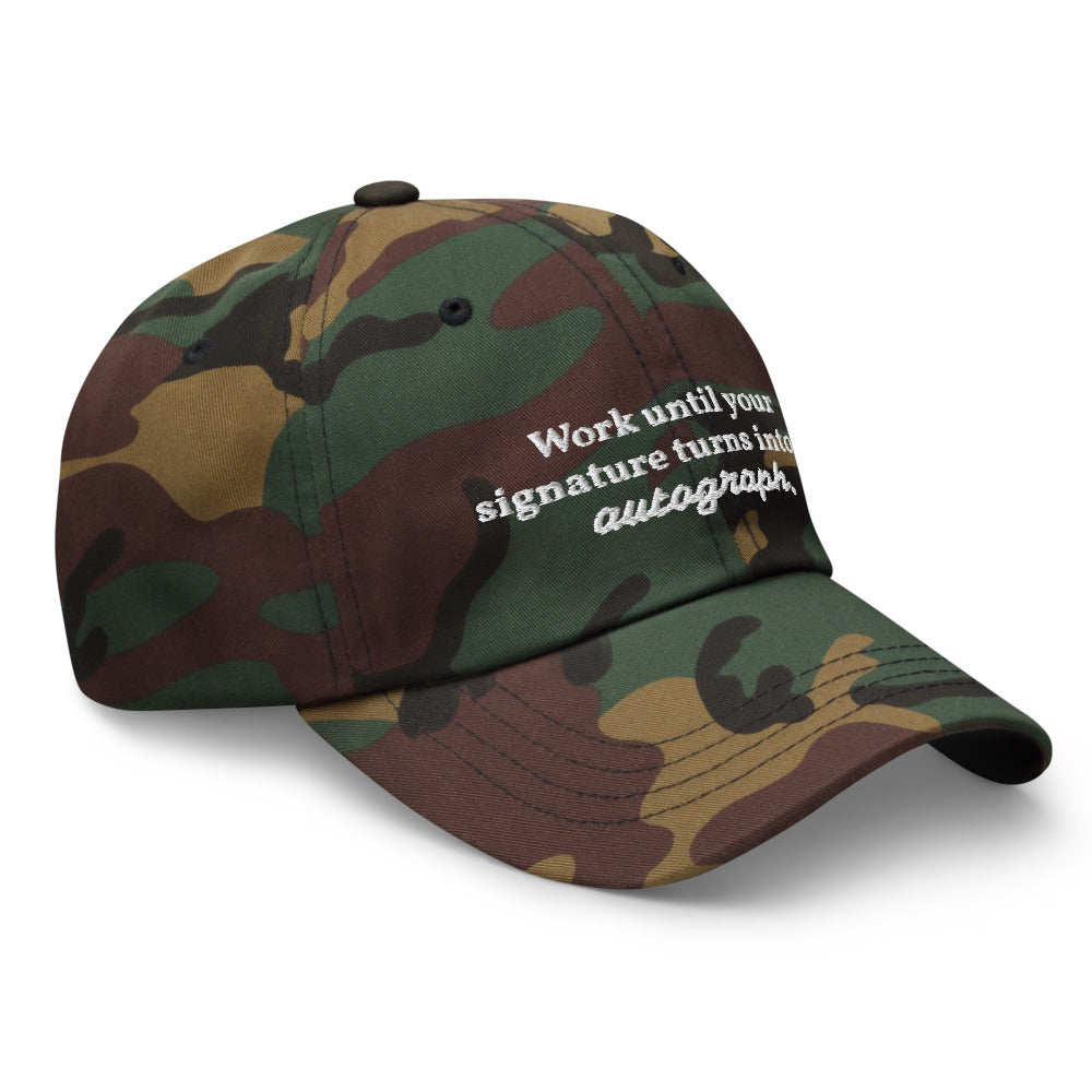 "Work until your signature turns into an autograph." Dad Hat