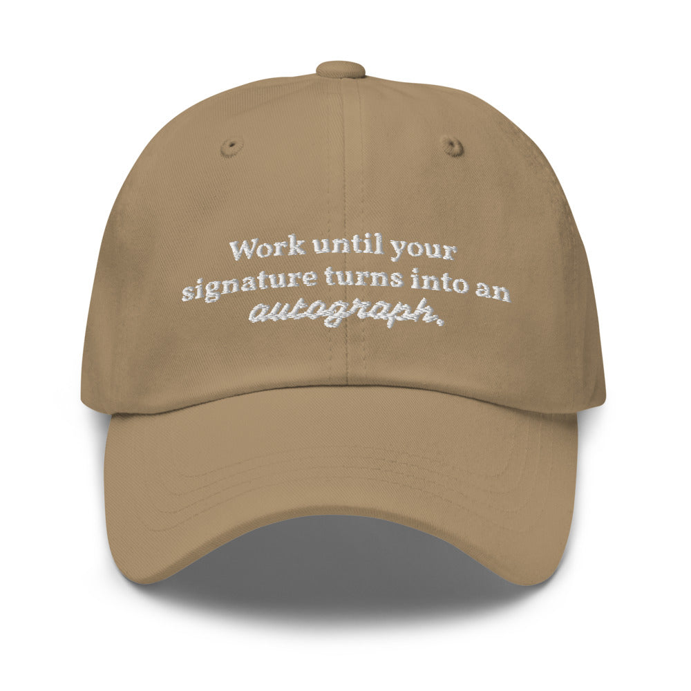 "Work until your signature turns into an autograph." Dad Hat