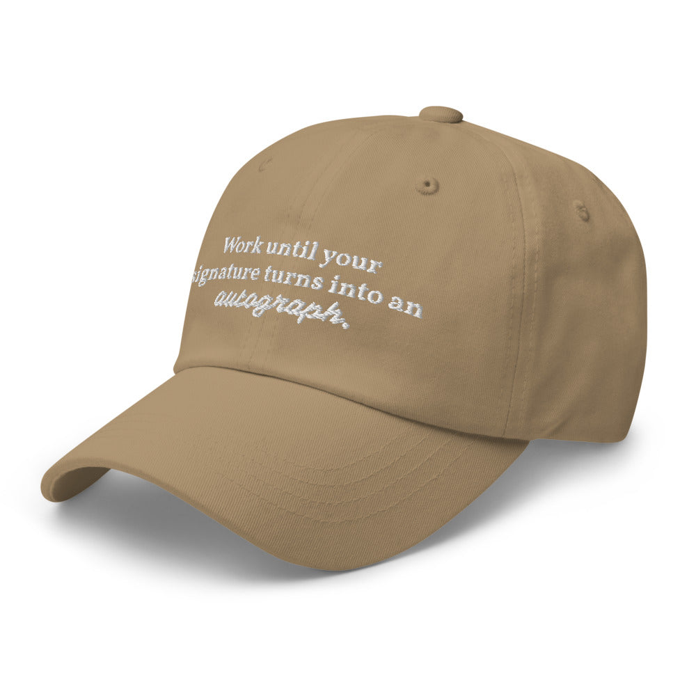 "Work until your signature turns into an autograph." Dad Hat
