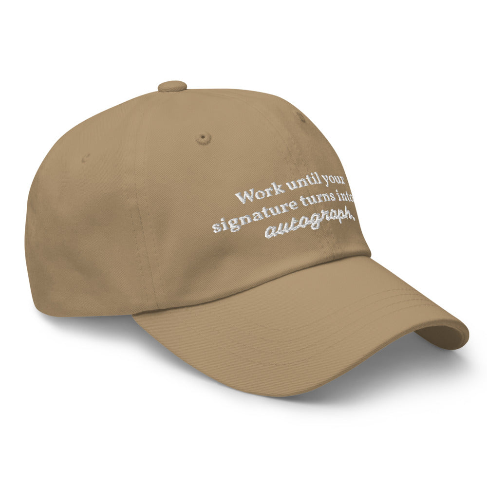 "Work until your signature turns into an autograph." Dad Hat
