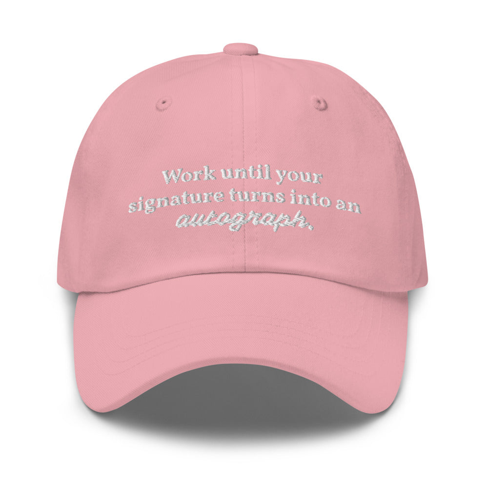 "Work until your signature turns into an autograph." Dad Hat