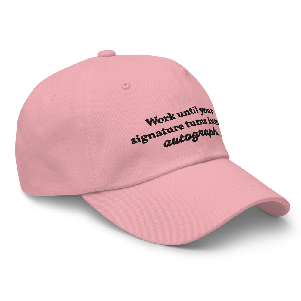 "Work until your signature turns into an autograph." Dad Hat