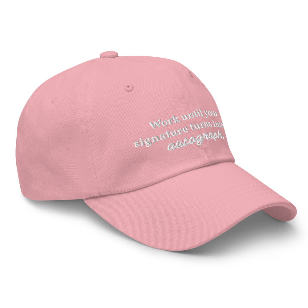 "Work until your signature turns into an autograph." Dad Hat