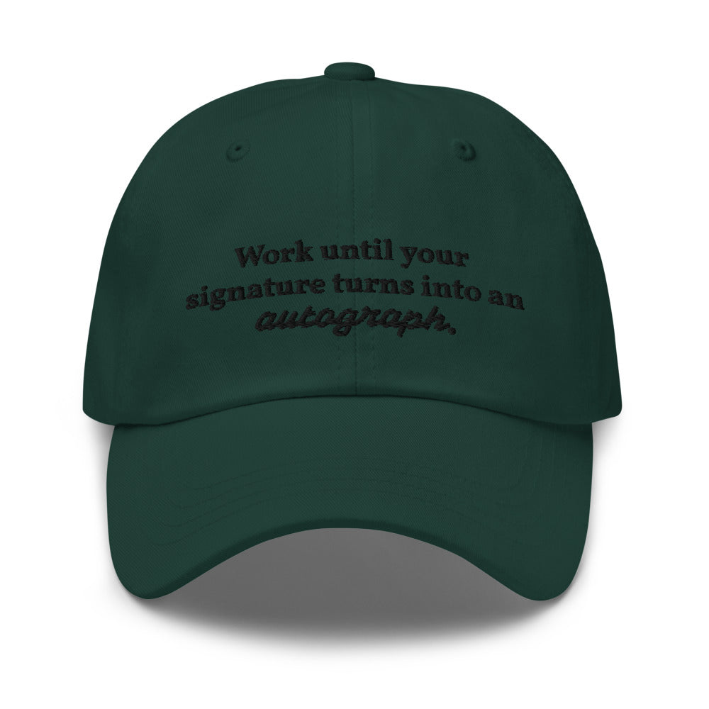 "Work until your signature turns into an autograph." Dad Hat