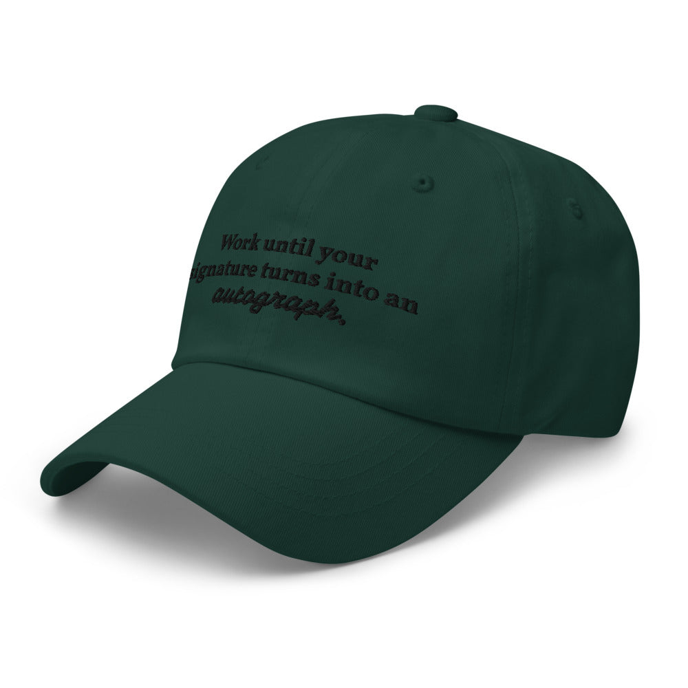 "Work until your signature turns into an autograph." Dad Hat