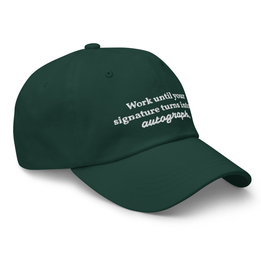 "Work until your signature turns into an autograph." Dad Hat