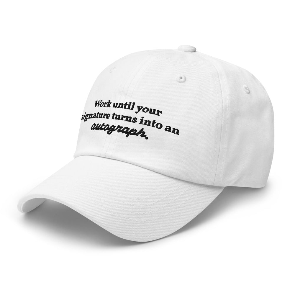 "Work until your signature turns into an autograph." Dad Hat