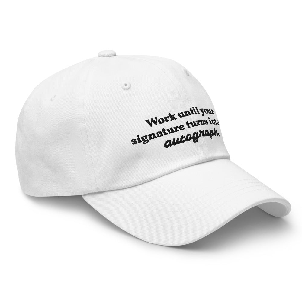 "Work until your signature turns into an autograph." Dad Hat